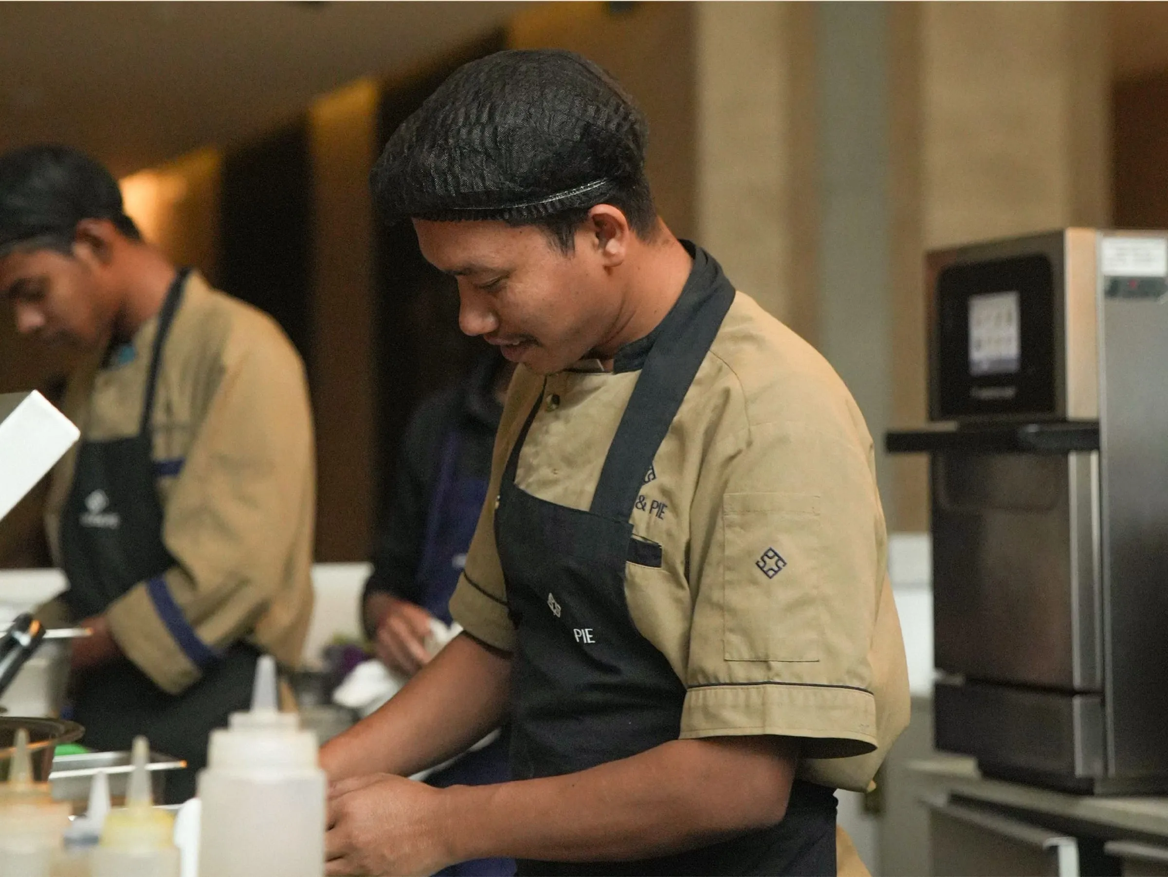 Paper & Pie baristas preparing orders behind the counter