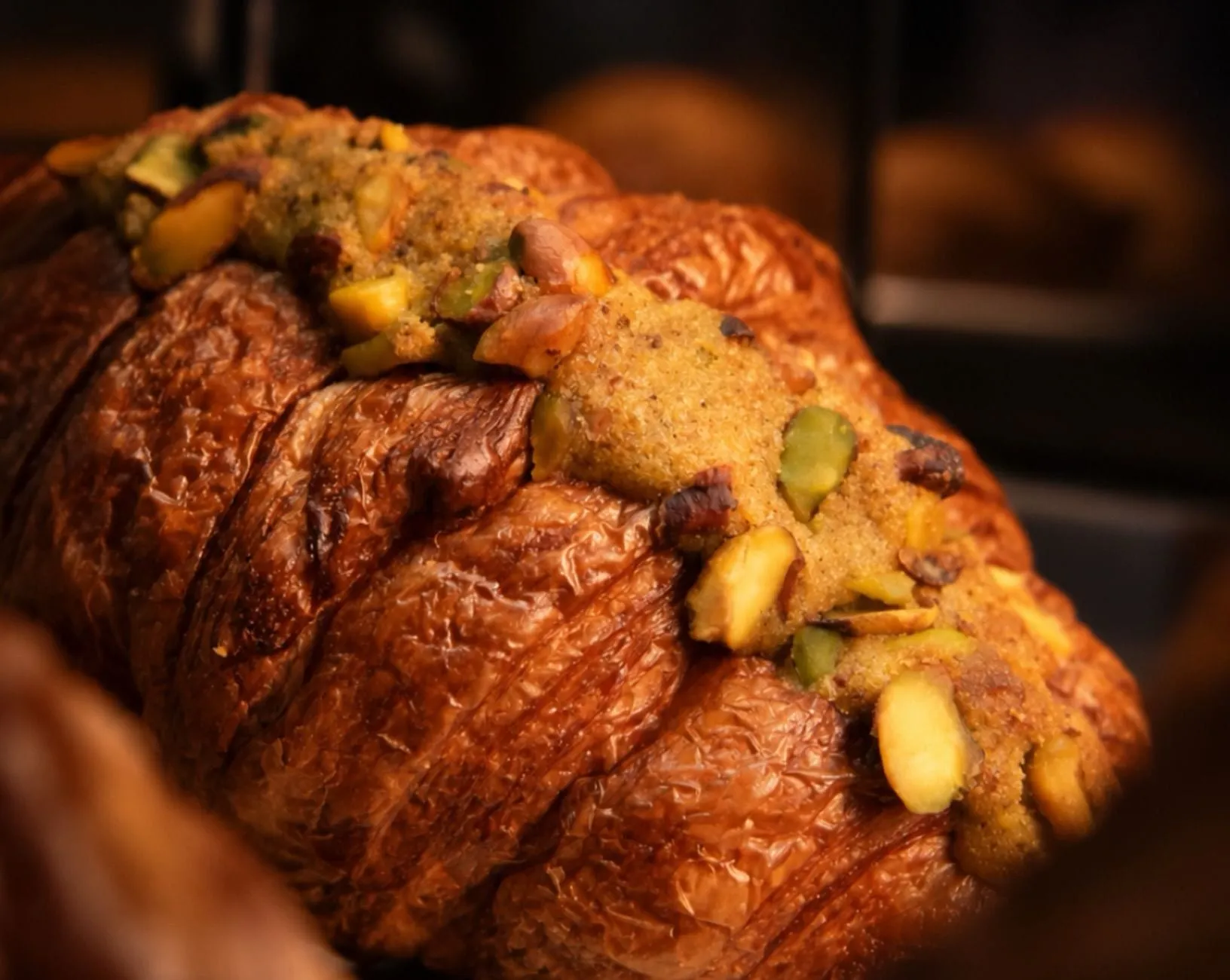 A pistachio croissant, flaky and golden
