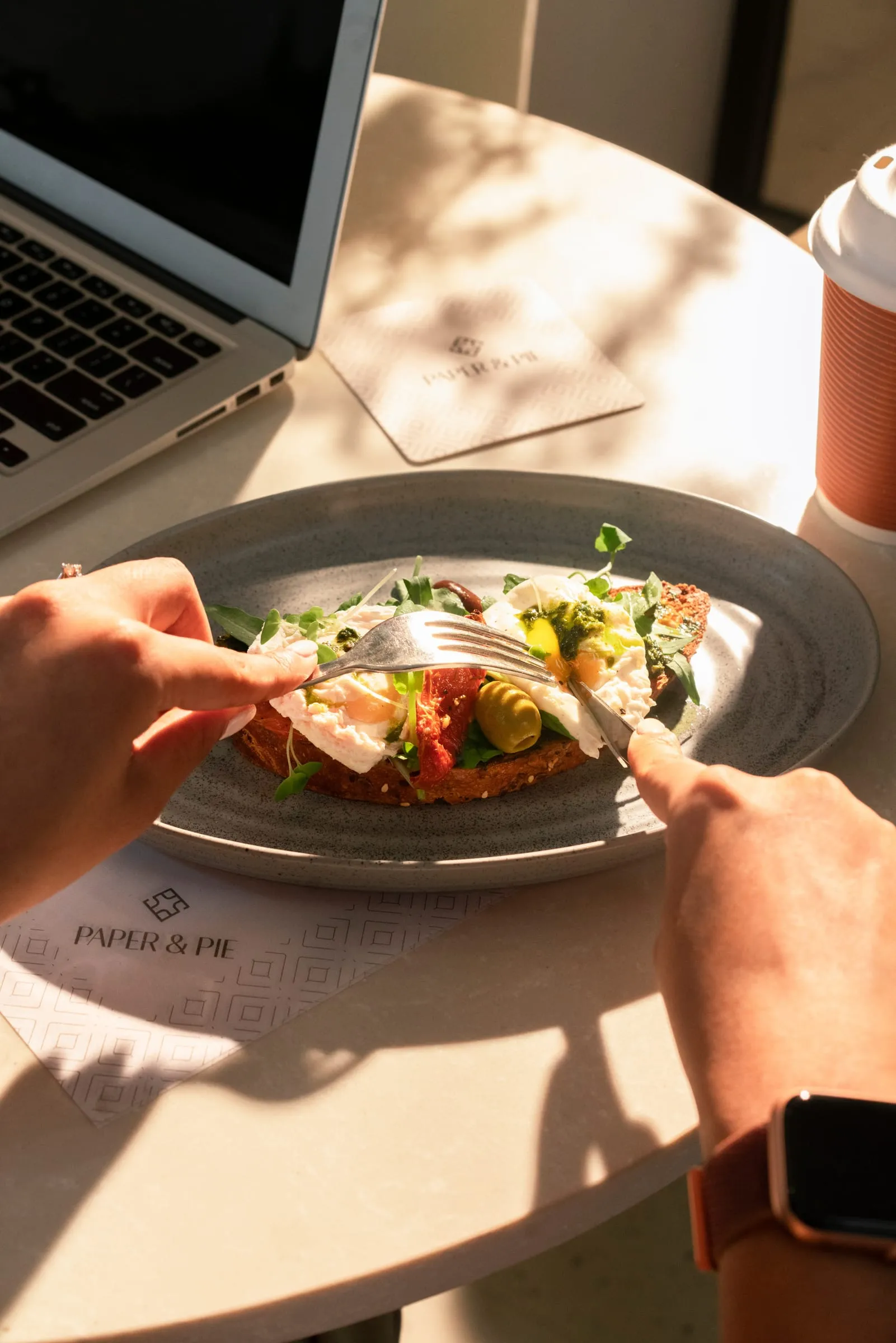 A toast plate with fresh toppings, cut with a knife and fork